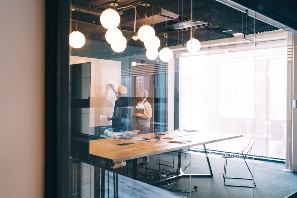 Office interior with modern ceiling lighting